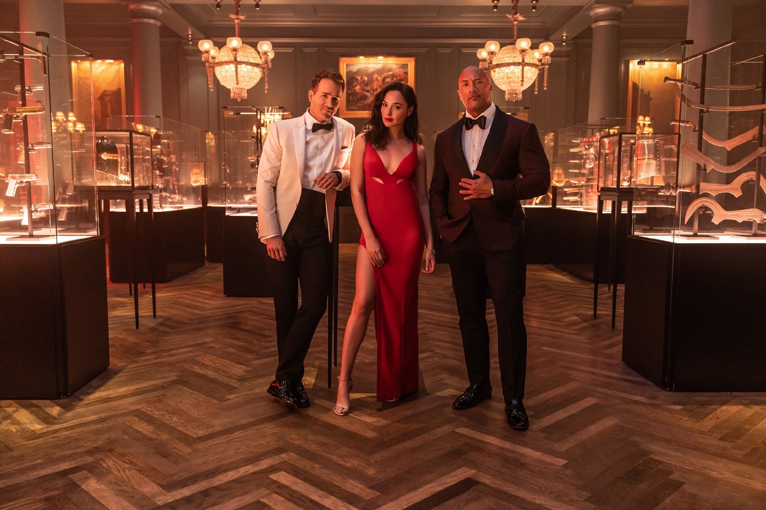 RED NOTICE - (L-R) RYAN REYNOLDS, GAL GADOT and DWAYNE ‘THE ROCK’ JOHNSON STAR IN NETFLIX’S RED NOTICE RELEASING NOVEMBER 12, 20