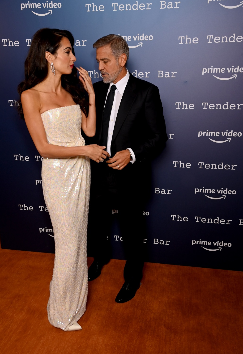 Amal Clooney and George Clooney attend "The Tender Bar" photocall during the 65th BFI London Film Festival at NoMad London on October 10, 2021 in London, England. 