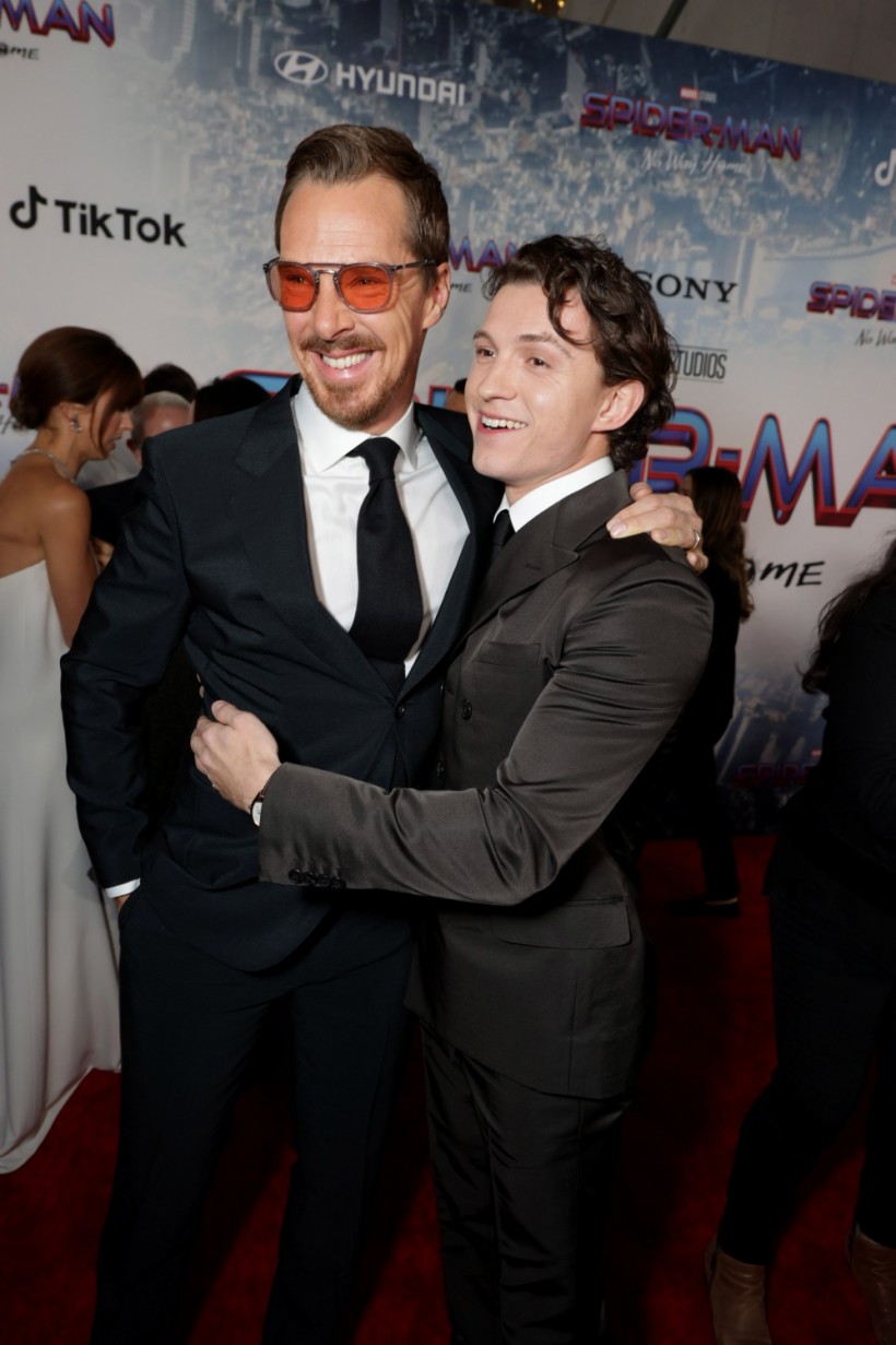 Tom Holland and Benedict Cumberbatch embrace on the Spider-Man No Way Home Red Carpet 