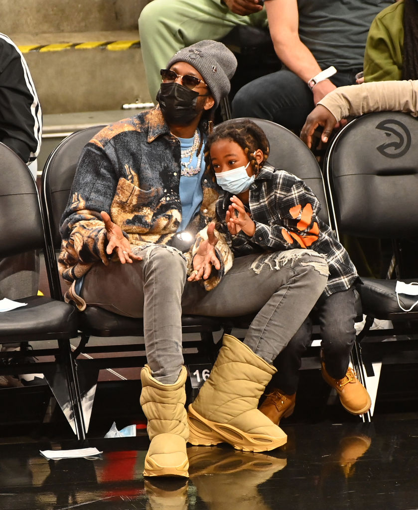 Rapper 2 Chainz (L) and his son Halo Epps attend the game between the Chicago Bulls and the Atlanta Hawks at State Farm Arena on December 27, 2021 in Atlanta, Georgia. (Photo by Paras Griffin/Getty Images)