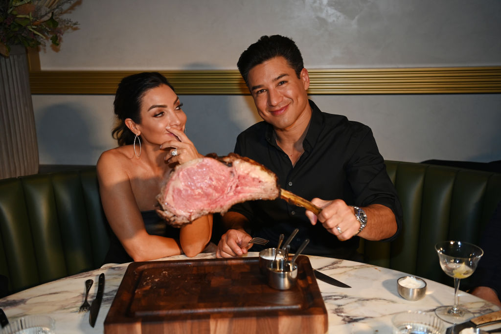 Actress Courtney Mazza and actor Mario Lopez attend the grand opening of Carversteak at Resorts World Las Vegas on December 29, 2021 in Las Vegas, Nevada. (Photo by Denise Truscello/Getty Images for Carversteak)