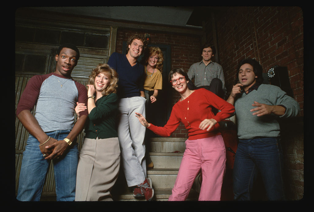 1981-Cast of the TV show "Saturday Night Live" pose on the set for a group photo. (Left to Right): Eddie Murphy, Robin Duke, Joe Piscopo, Christine Ebersole, Mary Gross, Tim Kazurinsky, Tony Rosato. 