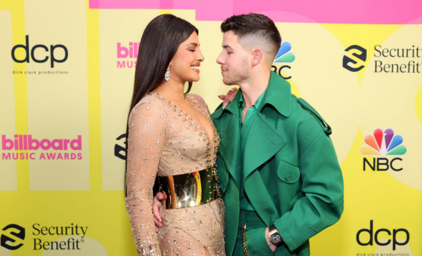 Priyanka Chopra Jonas and Nick Jonas pose backstage for the 2021 Billboard Music Awards, broadcast on May 23, 2021 at Microsoft Theater in Los Angeles, California. (Photo by Rich Fury/Getty Images for dcp)