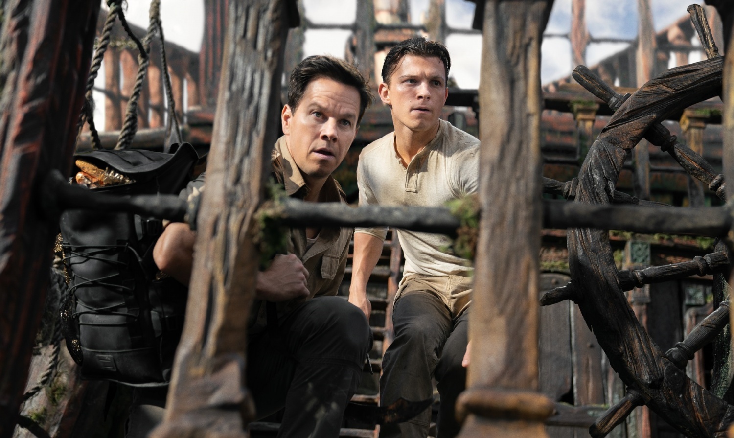 Victor "Sully" Sullivan (Mark Wahlberg) and Nathan Drake (Tom Holland) look to make their move in Columbia Pictures' UNCHARTED. photo by: Clay Enos