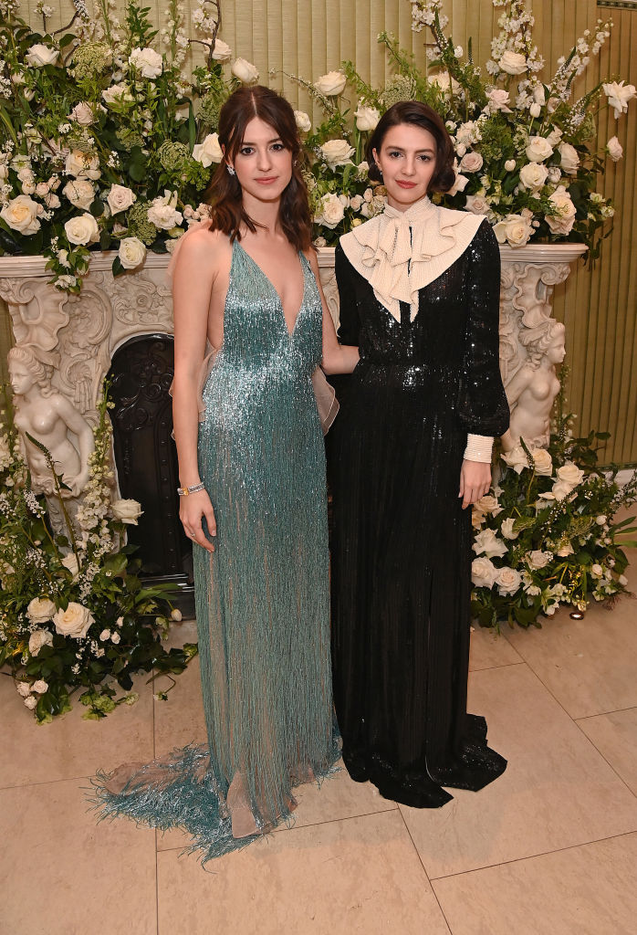  Actress Daisy Edgar-Jones, wearing Tiffany & Co., and Ella Hunt attend the British Vogue and Tiffany & Co. Fashion and Film Party 2022 at Annabel's on March 13, 2022 in London, England. 