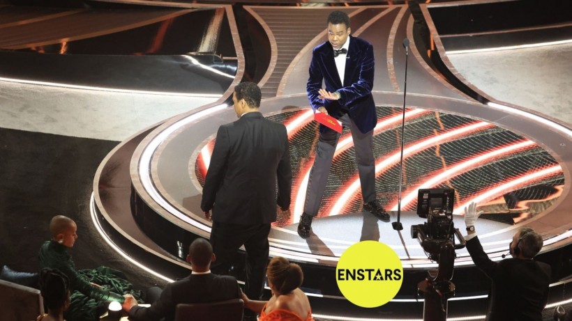 Denzel Washington talks to Chris Rock onstage during the show at the 94th Academy Awards at the Dolby Theatre at Ovation Hollywood on Sunday, March 27, 2022.