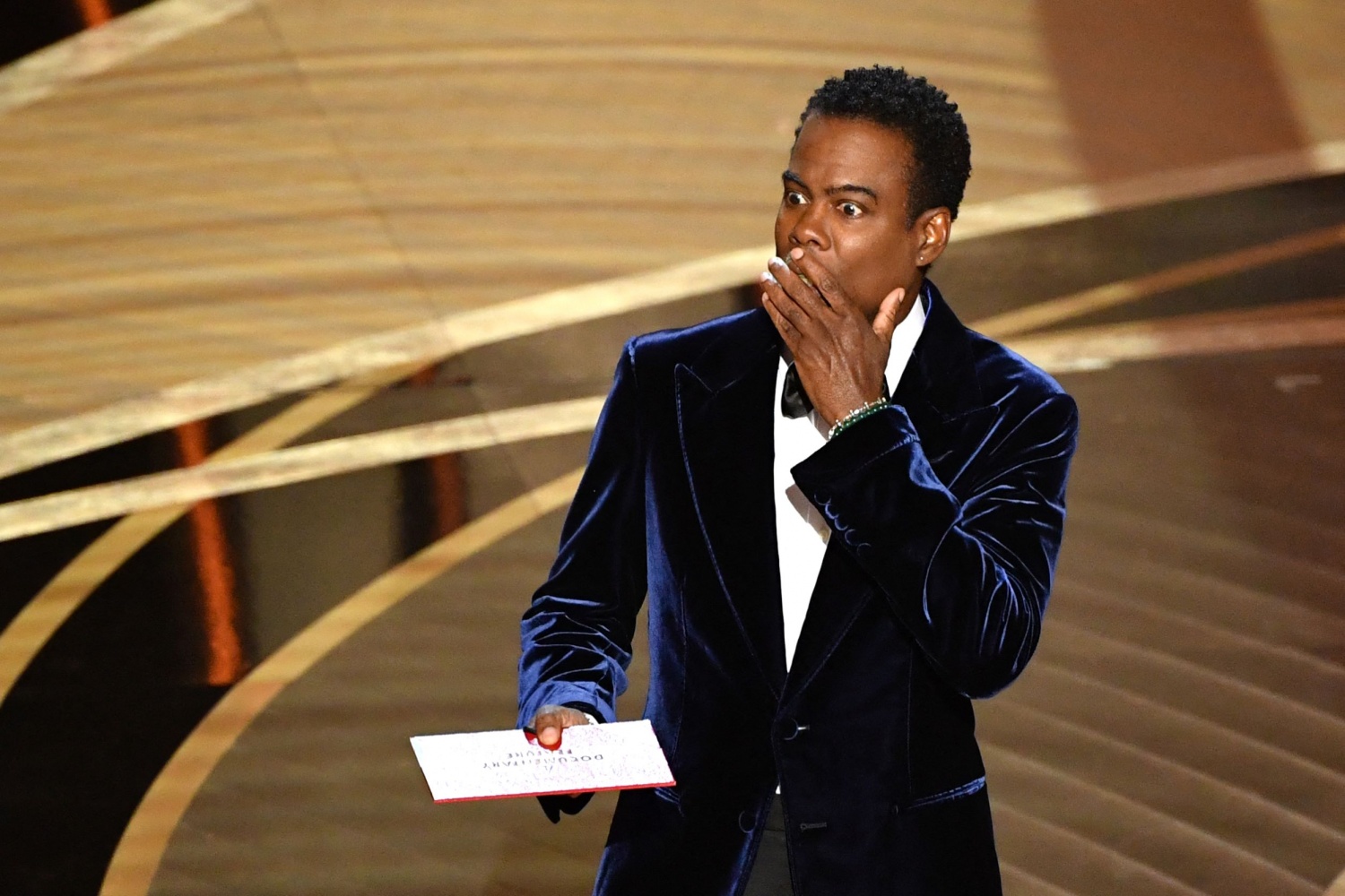US actor Chris Rock speaks onstage during the 94th Oscars at the Dolby Theatre in Hollywood, California on March 27, 2022. (Photo by Robyn Beck / AFP)