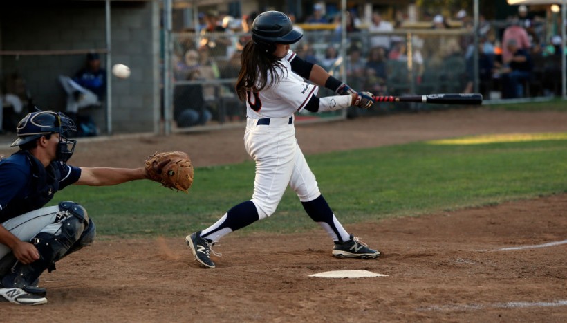 Stompers starting left fielder Kelsie Whitmore fouls off a pitch. 