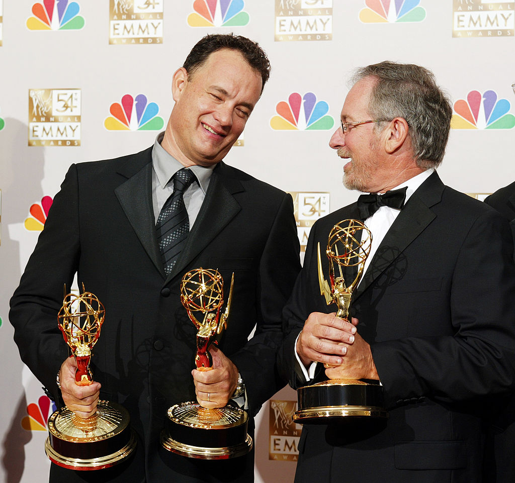 Executive Producer Tom Hanks (left) celebrates with EP Steven Spielberg in the press room after winning the Emmy for Outstanding Miniseries at the 54th Annual Primetime Emmy Awards at the Shrine Auditorium in Los Angeles, CA on Sunday, September 22, 2002.