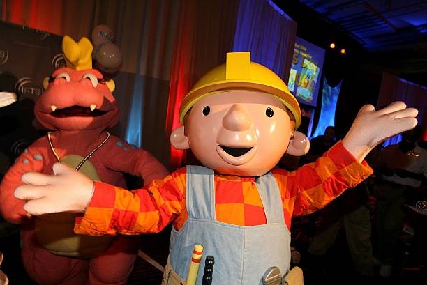 HOLLYWOOD - AUGUST 02: Barney and Bob the Builder poses as they arrive at the Hollywood Radio & Television Society 
