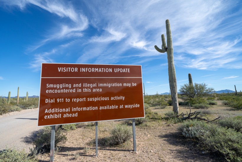 Sign at Organ Pipe National Monument, near the US and Mexico border, warns visitors to be aware of drug cartels and illegal immigration in the area