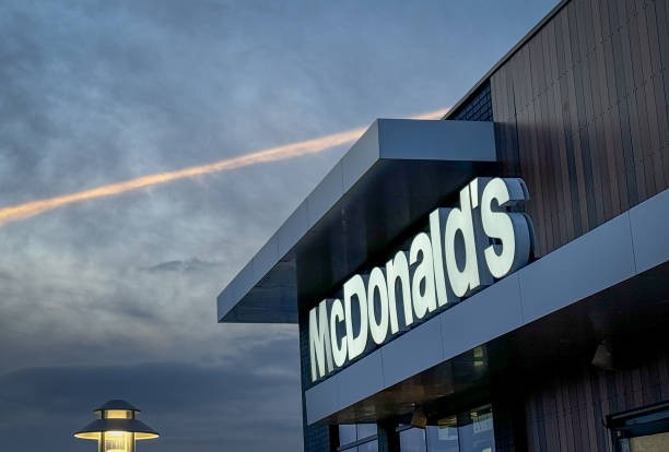 WELLINGTON, UNITED KINGDOM - JANUARY 30: The skies darken above the entrance to a branch of the fast food restaurant McDonald's, on January 30, 2024 in Wellington, England. Founded in 1940, American multinational fast food chain McDonald's Corporation, best known for its Big Mac hamburgers, cheeseburgers and french fries, is the world's largest fast food restaurant chain. 