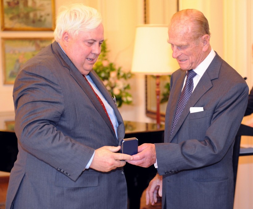Prince Philip, Duke of Edinburgh (R) presents Australian mining magnate and businessman Clive Palmer (L) 
