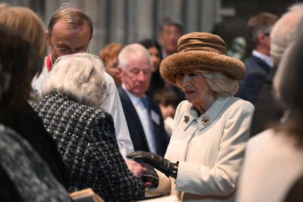 WORCESTER, ENGLAND - MARCH 28: Queen Camilla hands out the Maundy Money during the Royal Maundy Service where she distributes the money to 75 men and 75 women.