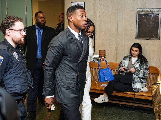 NEW YORK, NEW YORK - DECEMBER 15: Actor Jonathan Majors and Meagan Good arrive for closing arguments in Majors' domestic violence trial at Manhattan Criminal Court on December 15, 2023 in New York City. Majors had plead not guilty but faces up to a year in jail if convicted on misdemeanor charges of assault and harassment of an ex-girlfriend.