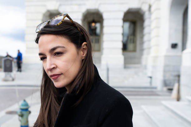 UNITED STATES - APRIL 1: Rep. Alexandria Ocasio-Cortez, D-N.Y., walks down the House steps at the Capitol after the last votes of the week on Friday, April 1, 2022.