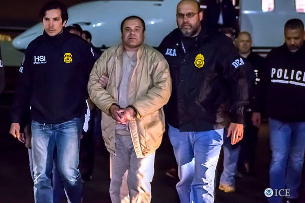 NEW YORK, NY - JANUARY 19, 2017: In this handout provided by U.S. Immigration and Customs Enforcement, Federal authorities announced Friday that Joaquin Archivaldo Guzman Loera, known by various aliases including, âEl Chapo,â will face charges filed in Brooklyn, New York, following his extradition to the United States from Mexico. Guzman Loera arrived in New York under heavy escort by special agents with U.S. Immigration and Customs Enforcement (ICE) Homeland Security Investigations and the Drug Enforcement Administration (DEA) and other authorities. 