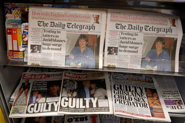 A selection of headlines from British newspapers is pictured in a store in London on December 30, 2021, the morning after a jury in New York found Ghislaine Maxwell guilty of recruiting and grooming young girls to be sexually abused by the late American financier Jeffrey Epstein. - Maxwell, who turned 60 on Christmas Day, was convicted by a 12-person jury of five of the six counts she was facing including the most serious charge of sex trafficking a minor. (Photo by Tolga Akmen / AFP) 
