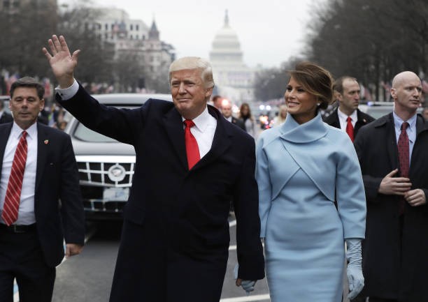 FILE: Bloomberg Best Of U.S. President Donald Trump 2017 - 2020: U.S. President Donald Trump waves while walking with U.S. First Lady Melania Trump during a parade following the 58th presidential inauguration in Washington, D.C., U.S., on Friday, Jan. 20, 2017. Our editors select the best archive images looking back at Trumps 4 year term from 2017 - 2020. 