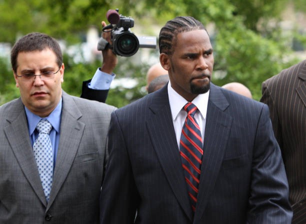 R. Kelly, right, arrives with manager Derrel McDavid at the Cook County Criminal Courts Building for his child pornography trial on May 20, 2008, in Chicago. 