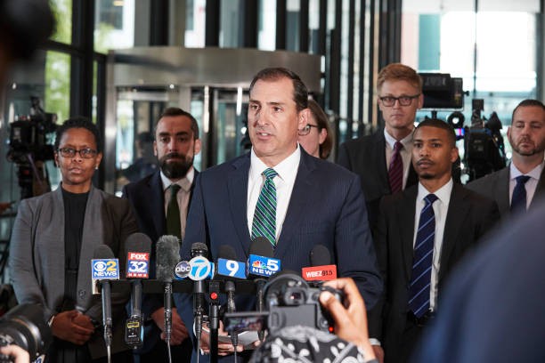CHICAGO, IL - SEPTEMBER 14: John R. Lausch, Jr., United States Attorney for the Northern District of Illinois, along with members of his office, addresses members of the press inside after the verdict in the R. Kelly trial in the Dirksen Federal Bldg on September 14, 2022 in Chicago, Illinois. 