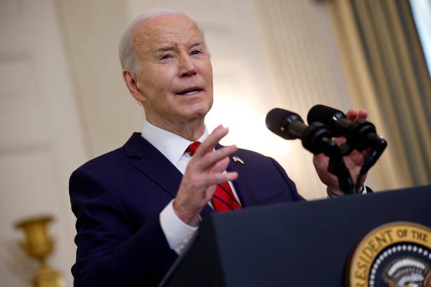 WASHINGTON, DC - APRIL 24: U.S. President Joe Biden delivers remarks after signing legislation giving $95 billion in aid to Ukraine, Israel and Taiwan in the State Dining Room at the White House on April 24, 2024 in Washington, DC. The legislation was months in the making and put Speaker of the House Mike Johnson (R-LA) in a vulnerable position with hardline conservatives in his own party who oppose funding for Ukraine’s defense against Russian invasion.
