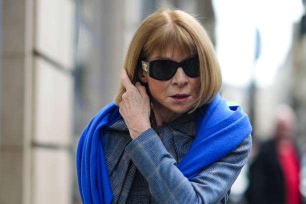 PARIS, FRANCE - FEBRUARY 28: Anna Wintour wears sunglasses, a blue scarf, a blue jacket , outside Dries Van Noten, during the Womenswear Fall/Winter 2024/2025 as part of Paris Fashion Week on February 28, 2024 in Paris, France.