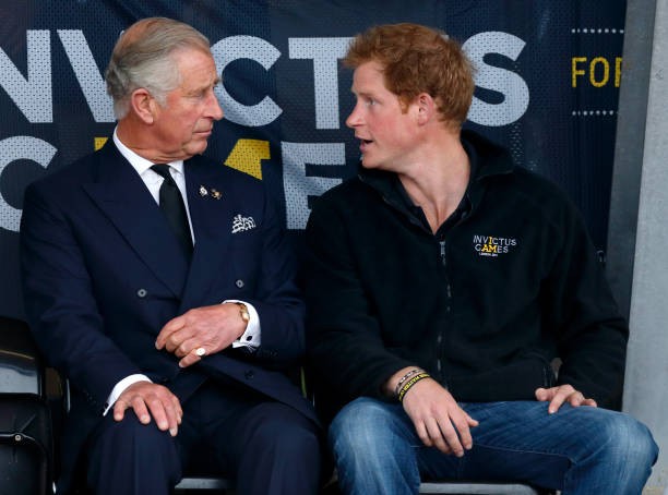 LONDON, UNITED KINGDOM - SEPTEMBER 11: (EMBARGOED FOR PUBLICATION IN UK NEWSPAPERS UNTIL 48 HOURS AFTER CREATE DATE AND TIME) Prince Charles, Prince of Wales & Prince Harry watch the athletics during the Invictus Games at the Lee Valley Athletics Centre on September 11, 2014 in London, England. 