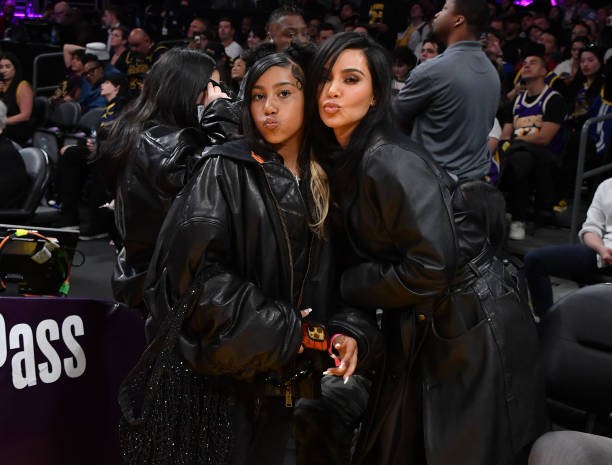 LOS ANGELES, CALIFORNIA - APRIL 09: Kim Kardashian (R) and North West attend a basketball game between the Los Angeles Lakers and the Golden State Warriors at Crypto.com Arena on April 09, 2024 in Los Angeles, California.