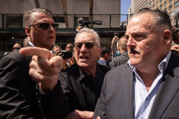 Actor Robert De Niro, center, points to a supporter of former US President Donald Trump, not pictured, as he departs following a news conference outside Manhattan criminal court in New York, US, on Tuesday, May 28, 2024.