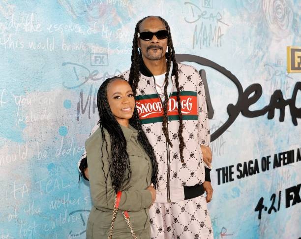 LOS ANGELES, CALIFORNIA - APRIL 18: (L-R) Shante Broadus and Snoop Dogg attend the premiere Of FX's 
