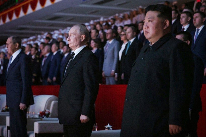 Vladimir Putin (C) and North Korea's leader Kim Jong Un
