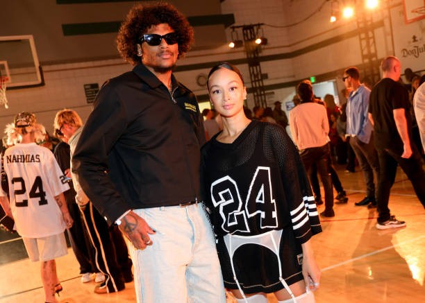 Jalen Green and Draya Michele at the NAHMIAS SS25 Menswear Show held at the Pan Pacific Park Gymnasium on June 9, 2024 in Los Angeles, California.