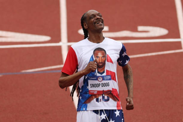EUGENE, OREGON - JUNE 23: Snoop Dogg runs on the track with a custom bib number on Day Three 2024 U.S. Olympic Team Trials Track & Field at Hayward Field on June 23, 2024 in Eugene, Oregon.