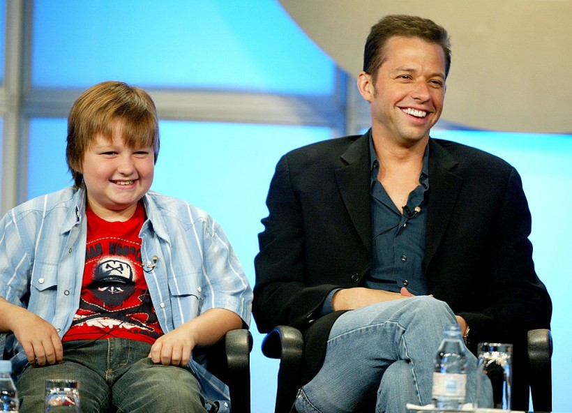 Jon Cryer (R) and actor Angus T. Jones attend the panel discussion for 