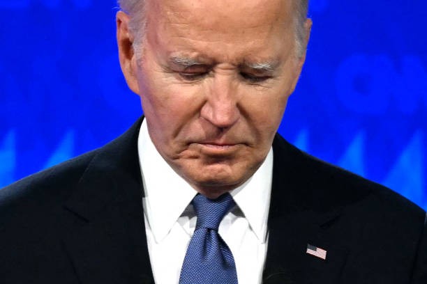 TOPSHOT - US President Joe Biden looks down as he participates in the first presidential debate of the 2024 elections with former US President and Republican presidential candidate Donald Trump.