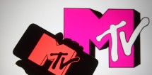 In this photo illustration a silhouette hand is seen holding a smartphone with MTV channel logo on a its screen. (Photo Illustration by Pavlo Gonchar/SOPA Images/LightRocket via Getty Images)